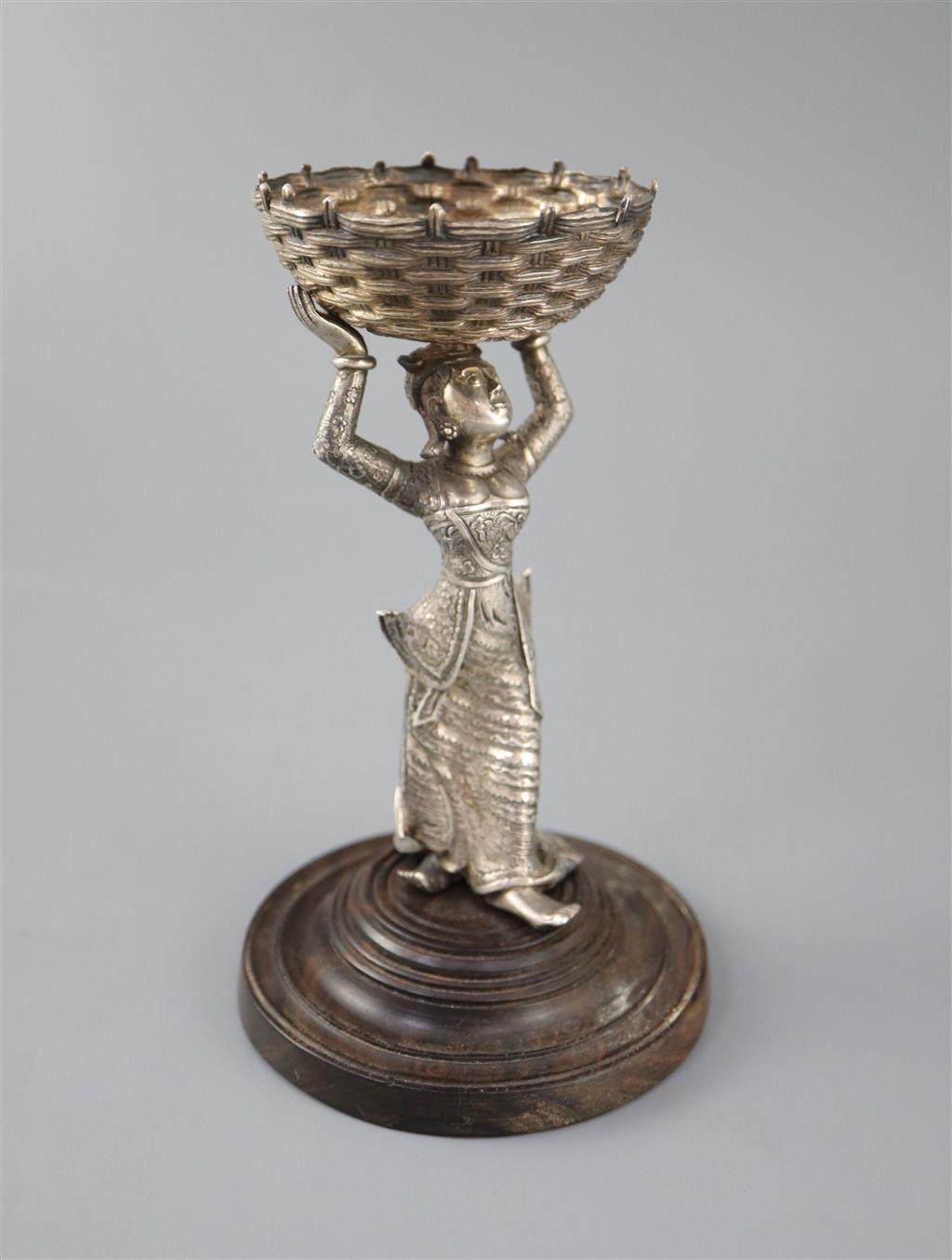 A 19th century Burmese engraved silver figural table salt,